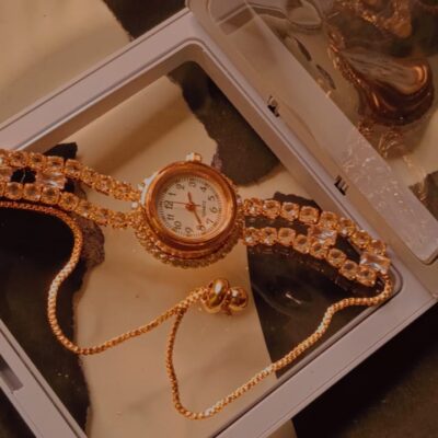 Gold crystal bracelet watch with adjustable chain in display box