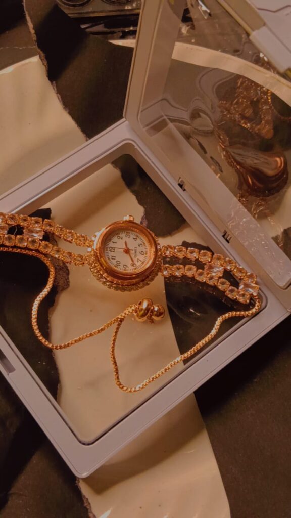 Gold crystal bracelet watch with adjustable chain in display box