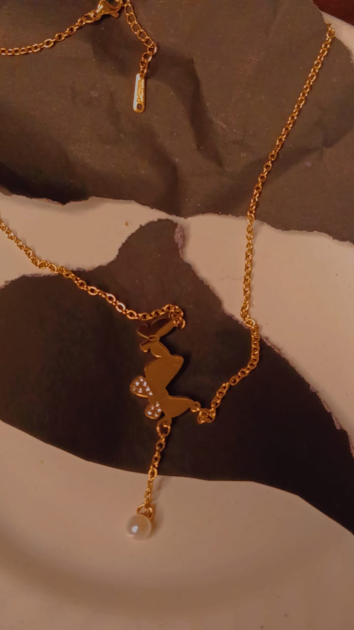 Golden butterfly necklace with pearl drop