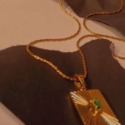 Rectangular gold pendent necklace with green stone centrepiece