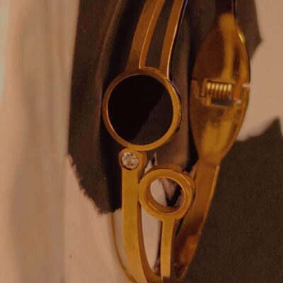 Elegant gold bracelet with dual circle design and sparkling crystal accent