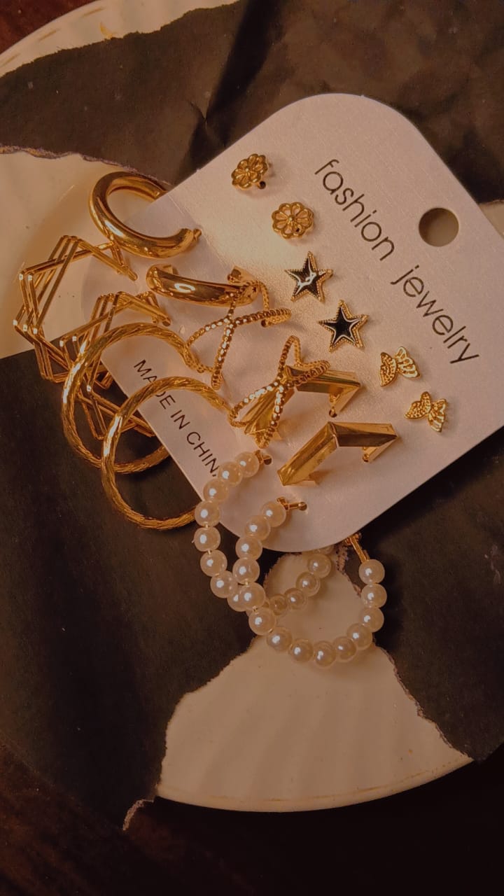 Golden and pearl hoop earrings set with 9 pairs of stylish gold-toned designs.