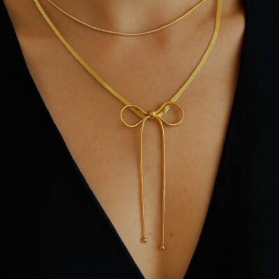 Layered gold bow pendent necklace with elegant adjustable design