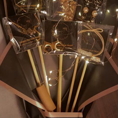 Golden jewelry bouquet with stainless steel accessories and fairy light