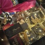 Pearlith luxury gift hamper containing chocolates, jewellery, hair accessories, and fairy lights arranged in a decorative box