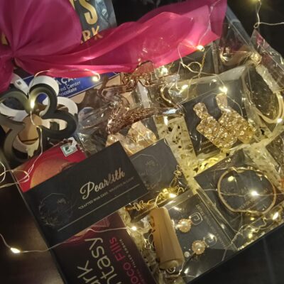 Pearlith luxury gift hamper containing chocolates, jewellery, hair accessories, and fairy lights arranged in a decorative box